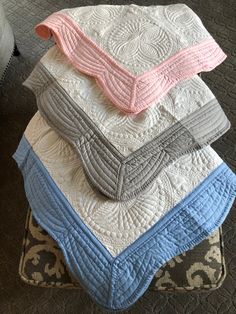 a stack of blankets sitting on top of each other