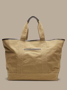 Banana Republic Large Tote Tan with two straps and a side pocket Khaki Rectangular Canvas Travel Bag, Large Capacity Khaki Canvas Travel Bag, Khaki Canvas Shoulder Bag With Canvas Lining, Khaki Canvas Travel Bag For Everyday Use, Everyday Use Khaki Canvas Travel Bag, Khaki Shoulder Bag With Canvas Lining, Casual Double Handle Waxed Canvas Bag, Casual Khaki Canvas Bag With Leather Handles, Casual Khaki Canvas Travel Bag