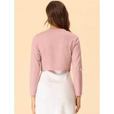 A good shrug is essential to every woman's wardrobe. Warm enough to wear on its own to keep your arms and upper back covered. The long-sleeve shrugs are also great if you have a sleeveless dress or a cute sleeveless shirt. It's darted at the bust to create a shapely figure, while the curved front at the back creates an elegant and stylish silhouette. Fitted Wrap Shrug For Layering, Long Sleeve Pink Shrug For Spring, Pink Long Sleeve Shrug For Spring, Elegant Long Sleeve Pink Crop Top, Pink Fall Shrug, Pink Open Front Fitted Tops, Pink Fitted Open Front Top, Long Sleeve Shrug For Spring, Crop Shrug