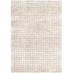 a beige rug with small white dots on the top and bottom, against a white background