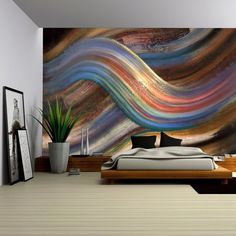 a bedroom with a large painting on the wall next to a bed and planter