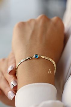 Handmade 14k Gold Evileye Bracelet for Women, Dainty 14k Gold Evileye Bracelet for Women This beautiful luxury bracelet is 14K Gold with evil eye charm on it to protect you from bad spirits if you are superstitious 😊. This is a great gold bracelet for everyday use, but also good for special occasions like weddings or birthdays. Length of bracelet is 19 cm, and its weight is 2.14 grams. Weight: 2.14 gr Length: 19 cm Since this is a handmade product there might be slight changes like its weight m 14k Gold Bracelets With Evil Eye, Elegant 14k Gold Evil Eye Bracelet Gift, Elegant Evil Eye Bangle Jewelry, Yellow Gold Evil Eye Jewelry For Anniversary, Elegant Yellow Gold Evil Eye Bracelet Gift, Elegant Evil Eye Chain Bracelet, Elegant Round Chain Bracelet With Evil Eye, Luxury Yellow Gold Evil Eye Bracelet Gift, Elegant Round Evil Eye Chain Bracelet