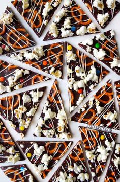 chocolate barkies with white and orange sprinkles are arranged in a circle