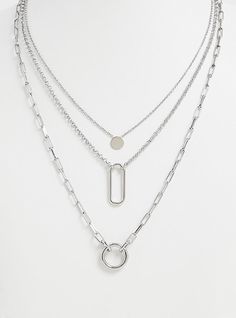 This silver-tone necklace features a solid disk, cutout oval, and cutout circle charms that layers together to create the perfect delicate statement. Lobster clasp. 19-24. 75” length with 5” extender . Base metals. Imported . The best plus size women's silver-tone geo charm layered necklace necklaces in silver. Layered Silver Necklaces Simple, Unique Silver Necklaces, Silver Jewelry Aesthetic Necklaces, Necklace Layering Ideas Silver, Cute Silver Necklaces, Layered Silver Necklaces, Silver Necklaces Layered, Pendant Necklace Outfit, Silver Layered Necklaces