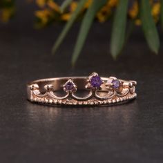 "Crown ring, Gold wedding ring, Amethyst ring, Rose gold ring, Purple stone ring, February birthstone, Women wedding ring, Gold crown ring WE OFFER UNLIMITED PERIOD INSTALLMENTS PLAN This is a beautiful, stunning, feminine ring that works well for all occasions, styles, and ages. You will love it! Ring information: Stone: Amethyst Approximate size: central stone - 2mm, 2 accent stones 1.5mm Metal type: Gold Metal stamp: 14k Gold Customization / Replacements It's easy to create jewelry that's per Rose Gold Amethyst Promise Ring, Rose Gold Amethyst Birthstone Ring For Promise, Rose Gold Amethyst Birthstone Promise Ring, Rose Gold Amethyst Gemstone Ring For Promise, Promise Amethyst Ring In Rose Gold, Promise Rose Gold Amethyst Gemstone Ring, 14k Rose Gold Amethyst Ring With Prong Setting, Rose Gold Crown Design Ring As Gift, Rose Gold Amethyst Ring With Accent Stones For Anniversary