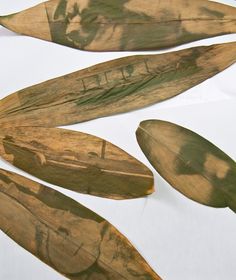 four leaf shaped objects with writing on them