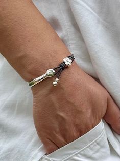 This wrap leather bracelet is handmade to order by me using real leather cord - 2mm, silver plated zamak clasp and silver plated beads.  📌HOW TO CHOOSE YOUR BRACELET SIZE: - Using a flexible measuring tape, measure the smallest part of your wrist (the wrist joint, where your arm connects to your hand) - Ensure that it is tight around your wrist  - Add 0.25 inches for comfort - This is your bracelet size  Bracelet sizes are very individual and different for everyone and it is important to make s Silver Leather Wrap Bracelet As A Gift, Silver Leather Wrap Bracelet Perfect As A Gift, Adjustable Silver Leather Bracelet With Sliding Knot, Adjustable Silver Leather Bracelet Hand Wrapped, Adjustable Silver Leather Bracelet With Sterling Silver Clasp, Adjustable Hand Wrapped Silver Leather Bracelet, Handmade Adjustable Silver Wrap Bracelet, Handmade Silver Leather Bangle Bracelet, Adjustable Handmade Silver Wrap Bracelet