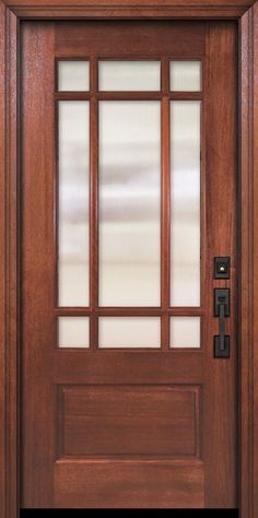 a wooden door with frosted glass panels