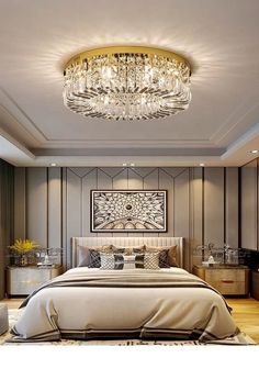 a large bed sitting under a chandelier in a bedroom