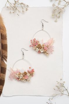 Flower circle dangle earrings. Romantic vintage style. In pink/blush colours. Can be used for weddings, other events or just everyday use. The earrings are made of preserved flowers, leaves and grass, wire, and other trinkets used for arranging :) Diameter: 6cm (2.5 inches), weight only 8-10g, length 8cm 3cm (1.2 inches), weight only 5-8g Please choose the material: 1. GOLD IMITATION HOOK (golden imitation wire/circle + golden imitation hook) 2. SURGICAL STEEL HOOK (silver imitation wire + surgi Pink Bohemian Jewelry With Pressed Flowers, Bohemian Pink Jewelry With Pressed Flowers, Feminine Pink Jewelry With Handmade Flowers, Pink Birth Flower Dangle Jewelry, Pink Dangle Jewelry With Pressed Flowers, Pink Pressed Flower Drop Earrings, Pink Dangle Earrings With Pressed Flowers, Pink Drop Earrings With Pressed Flowers, Silver Earrings With Pressed Flowers For Wedding