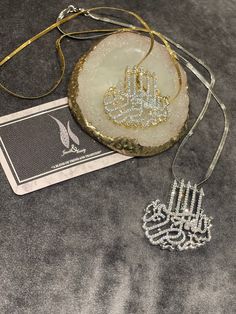 Stunning Islamic calligraphy jewellery Bismillah pendent with chain. Available in gold and silver plating. Silver Hand Set Necklace For Gifts, Hand Set Silver Necklace For Gift, Hand-set Silver Necklace Gift, Silver Jewelry Sets For Eid, Silver Hand Set Jewelry For Eid, Silver Plated Jewelry Sets As Gift, Hand Set Jewelry As Eid Gift, Hand Set Jewelry Gift For Eid, Elegant Jewelry Sets As Eid Gift