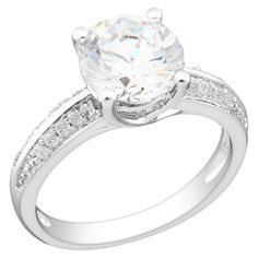 a diamond engagement ring with channeled shoulders and an oval center stone on the side