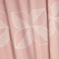 a pink curtain with white leaves on it