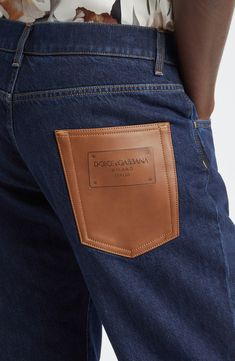 A logo-embellished leather patch replaces the back pocket of classic-fit straight-leg jeans crafted from rigid denim. 33" inseam; 15" leg opening; 10 1/2" front rise; 13 1/2" back rise (size 48EU) Zip fly with button closure Five-pocket style 100% cotton with leather contrast Machine wash, line dry Made in Italy Designer Clothing Luxury Denim Straight Leg Bottoms, Luxury Straight Leg Denim Bottoms, Classic Brown Jeans, Straight Leg Jeans In Denim Blue With Logo Patch, Denim Blue Straight Leg Jeans With Logo Patch, Luxury Denim Blue Bottoms With Five Pockets, Straight Leg Denim Blue Jeans With Logo Patch, Designer Denim Jeans With Pockets, Designer Denim Bottoms With Pockets