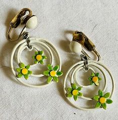 Vintage Enamel Earrings Cute Dasies In Circles Very 60s  | eBay Vintage Yellow Enamel Jewelry, Vintage Dangle Earrings For Spring, Vintage Green Enamel Earrings, Green Enamel Vintage Earrings, Retro White Dangle Earrings, Vintage Enamel Clip-on Earrings, Handmade Vintage Earrings For Spring, Vintage Spring Jewelry Nickel Free, Retro Dangle Jewelry