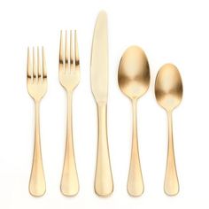 gold flatware set with spoons, knives and forks