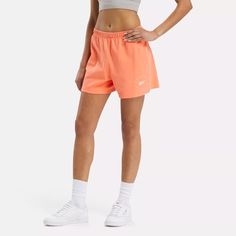 Casual and cozy-soft, these women's Reebok shorts are your go-to pair, any day and every day. Heavyweight cotton jersey is comfortable from the backyard barbecue to the music festival. Roll over the waistband for a stylish look and a pop of color. Cotton High-waisted Shorts Activewear For Spring, Spring Cotton High-waisted Activewear Shorts, Spring Cotton High-waisted Shorts Activewear, Spring Workout Cotton Shorts, Spring Workout Relaxed Fit Athletic Shorts, Spring Cotton Workout Shorts, Casual Streetwear Athletic Shorts, Spring Moisture-wicking Relaxed Fit Athletic Shorts, Spring Sportswear Shorts With Relaxed Fit