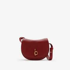 Mini Rocking Horse Bag in Ruby - Women | Burberry® Official Formal Saddle Bag With Adjustable Strap, Formal Saddle Bag With Detachable Strap, Formal Saddle Bag With Leather Lining, Formal Leather Lined Saddle Bag, Formal Saddle Bag With Gold-tone Hardware, Classic Saddle Bag With Metal Hardware, Formal Saddle Bags With Gold-tone Hardware, Brown Crossbody Bag With Horsebit Detail, Burberry Barrel Bag