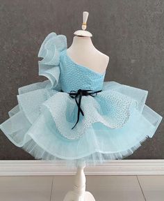 One Shoulder Blue Tutu Dress - Glittery Baby Birthday Dress for Toddler Girls ✨ Unveil the Magic of Blue with Our Enchanting Tutu Dress! ✨ Celebrate your little one's special moments with our gorgeous One Shoulder Blue Tutu Dress. Perfect for birthdays, parties, and other memorable occasions, this elegant dress blends charm and sparkle to create a truly magical experience. 👗 Key Features: Chic Design: This dress showcases a stylish one-shoulder strap and a voluminous tutu skirt enhanced with sh Blue Tulle Dress For Party, Blue Princess Dress For Party Season, Blue Tulle Party Dress, Blue Tulle Dress For Fancy Dress, Light Blue Sleeveless Princess Dress For Party, Light Blue Sleeveless Princess Dress For Pageants, Sleeveless Light Blue Princess Dress For Pageant, Blue Princess Dress For Party, Blue Pageant Dress For Spring