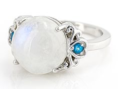 12mm Round Rainbow Moonstone With .06ctw Neon Apatite Rhodium Over Sterling Silver Ring. Measures approximately .71"L x .47"W. Not sizeable. Finished under gallery. Crystal System, Broken Chain, Pearl Strands, Cultured Pearls, Rainbow Moonstone, Gemstone Colors, Sterling Silver Ring, Post Earrings, Sapphire Ring