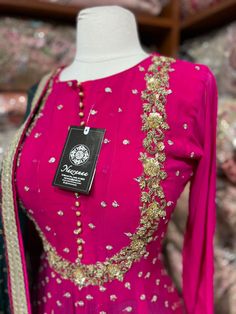 Barbie pink color suit intricate with floral sequence embroidery with zardozi, beads, sequence and zari work. Completed look with dhoti style stone work contrasting olive green pant and georgette dupatta. Fabric: Georgette Size: 40/L Occasion: Wedding Events WASH CARE INSTRUCTIONS - Please Dry clean only when it is applicable. Slight color variation is possible due to photography. Ready to Ship! Barbie Pink Color, Sequence Embroidery, Georgette Dupatta, Olive Green Pants, Zari Work, Pink Parties, Green Pants, Stone Work, Wedding Events