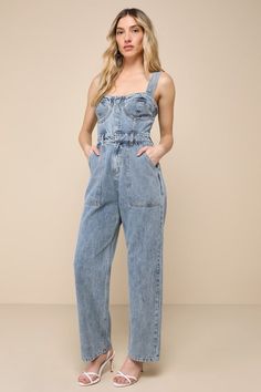 This spring will be full of admirers and compliments with a trendy look like the Lulus Fresh Perfection Light Wash Bustier Sleeveless Denim Jumpsuit! Slightly acid-washed 100% cotton denim shapes this too-cool jumpsuit that features a bustier-inspired bodice with seamed cups and a sweetheart neckline, supported by wide adjustable tank straps. A hidden snap button placket secures the front of the bodice, atop a banded waist with convenient belt loops and a hidden zip fly. The relaxed, straight pa Jumpsuit Denim, Black Strapless Jumpsuit, Denim Bustier, Chiffon Jumpsuit, Jumpsuit Blue, Two Piece Jumpsuit, Backless Jumpsuit, Floral Print Rompers, Strapless Romper