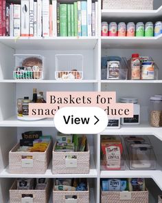 an organized pantry with white shelves and baskets