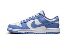 The Nike Dunk Low "Polar Blue" is a colorway of the retro basketball sneaker with a clean two-tone color block highlighted by light blue.  Reminiscent of the classic “UNC” colorway, this Dunk has a white leather base and Polar Blue leather overlays.  A Polar Blue leather Swoosh appears on the mid-panel.  “Nike” branding is embroidered on the heel and printed on the tongue.  A white midsole and blue outsole complete the look.  Release date: October 14, 2023 Blue White Shoes, Iconic Sneakers, Nike X Travis Scott, Sneaker Culture, Low Air Jordan 1, Dunks Nike, Adidas Spezial, Nike Dunk High, Nike Brand