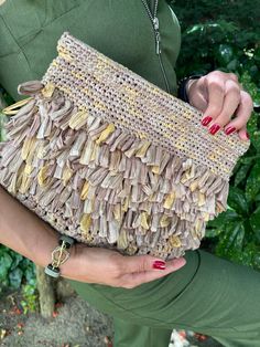 This lightweight raffia clutch is perfect for any occasion. Whether it's a night out, brunch with friends, or casual events, this clutch will suit you perfectly. It is a well-made and classy clutch. Unique and original to use or as a gift In case of several orders do not hesitate to contact us to see a better-bundled shipping rate. DETAILS: * Premium quality raffia * Hand-crocheted with care Dimensions: 28x21 cm Raffia Clutch Bag/Pouch Bag/Knitted Cloud Bag/Straw Clutch/Boho Bag/Beach Bag/Straw Raffia Clutch, Cloud Bag, Straw Clutch, Rattan Bag, Boho Bag, Woven Bag, Pouch Bag, Clutch Handbag, Hand Crochet