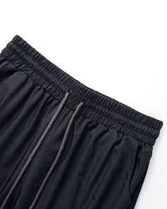 Details: Long parachute pants with stripes designBottom Length: LongMaterials:95% Polyester + 5% Spandex Black Nylon Techwear Bottoms, Urban Black Nylon Bottoms, Black Nylon Urban Bottoms, Stretch Black Parachute Pants For Outdoor, Black Stretch Parachute Pants For Outdoor, Black Nylon Bottoms With Elastic Waistband, Black Stretch Joggers With Cargo Pockets, Black Wide-leg Summer Cargo Pants, Black Wide-leg Cargo Pants For Summer