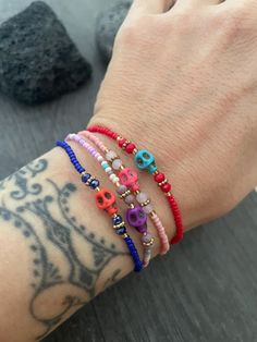 -----Price per Item------ Everyday sugar skull beaded bracelets. Fun colorful skull bracelets that you can layer with other accessories or wear by themselves. They are available in 4 colors for you to choose from. Red, Purple, Pink and Blue, THE COLORS ARE BASED ON THE BEADS COLOR, NOT THE SKULL COLOR. A most have addition to your everyday bracelets. ⚡️GET 20% OFF NOW⚡️ JOIN AKASHI'S VIP LIST and Shop ⚡️Join Akashi's VIP list for early bird discount access⚡️ Paste into your browser http://eepurl.com/hgCMM1 and follow the simple steps. Enjoy Con salud Skull Pattern Bracelet, Skull Bracelet Pattern, Skull Bead Bracelet Ideas, Beaded Skull Bracelet, Festival Skull-shaped Beaded Jewelry, Punk Black Skull Bracelets, Grunge Jewelry, Colorful Skulls, Everyday Bracelet