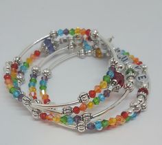 "Memory Wire Bracelet Always Love you Tribute bracelet for the one you love! Made with fine Czech beads and metal spacer beads. This would be a great lovers gift, gift for girlfriends, gift for mom, or BFF! Jewelry gifts are always appreciated and this piece of statement jewelry says just how you feel. Rainbow bracelets are great for showing pride and this memory wire bracelet is a charm among whimsical bracelets and charm bracelets alike. Love jewelry comes from the heart. The bracelet was made Chakra Bracelet Jewelry, Candlewicking Embroidery, Memory Wire Wrap Bracelets, Jewellery Diy, Bff Jewelry, Beaded Things