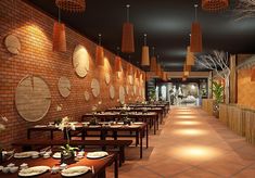 an empty restaurant with tables and chairs lined up against the wall, along with hanging lights