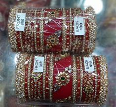 Created Timeless Glamour With Stunning Red Rajwadi Chura Set. Embellished With High Quality Glass Kundan Work. Center Piece Is Decorated With Floral Shape Metal Figures With Glass Kundan Fitting. Pearls Beaded Bangles Are Placed In A Pleasing Manner With Pearls Bunches Bangles At Both End Of This Ensemble. Feel The Moment Of Perfect Appreciation In This Exclusive Creation. This is a set of 30 Bangles (15 For Each Hand). Bollywood Dupatta For Marriage And Festivals, Bollywood Lehenga For Diwali Marriage, Bollywood Style Dupatta For Marriage And Festivals, Traditional Zari Work Sets For Marriage, Zari Work Dupatta For Marriage Festivals, Festive Marriage Sets With Zari Work, Traditional Lehenga For Marriage Diwali, Traditional Lehenga For Marriage And Diwali, Red Kundan Wedding Sets