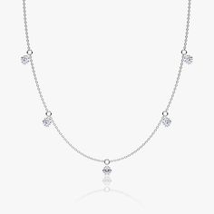 The Floating Station Necklace features a series of ¼ carat Round Brilliant VRAI created diamonds that gently dangle from their pierced-diamond settings. Gift Diamond Dangle Necklace, Gift Dangle Diamond Necklace, Anniversary Dangle Diamond Necklace, Brilliant Cut Diamond Dangle Jewelry, Minimalist White Gold Diamond Necklace With Lab Grown Diamonds, Minimalist White Gold Lab Grown Diamond Necklace, Classic White Gold Dangle Necklace, Dainty Dangle Diamond Necklace, Dainty Diamond Dangle Necklaces