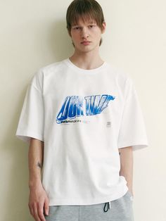 This is a casual and comfortable t-shirt that is made out of high quality cotton and polyester blend fabric. With design detail of unique graphic print on the front chest, it gives a trendy and refined look. - Semi oversized silhouette- Graphic print on the front chest- Ribbed round neckline Modern White T-shirt With Graphic Print, Modern White T-shirt With Screen Print, Modern White T-shirt With Text Print, Modern White T-shirt With Letter Print, Urban White T-shirt With Text Print, Time Graphic, Oversized Silhouette, Half Sleeve, Half Sleeves