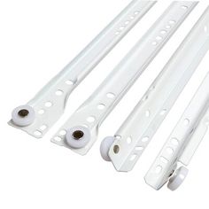 four pieces of white plastic with holes on them