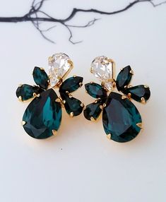 "Emerald earrings,Emerald bridal earrings,Emerlad green statement earrings,Emerald cluster earrings,Swarovski earrings,Bridesmaids gift Unique, elegant earrings. Can be made with any Swarovski colors. Please contact me. They are made of gold plated brass and Swarovski crystals. Made with CRYSTALLIZED™ - High-quality genuine Swarovski crystals. ✤ Available in other metal finishes at the drop-down menu. ✤ Stud/post Earrings. Clip-on earrings are available upon request. ✤ Size approx - 32 mm x 24 m Green Cluster Earrings For Wedding, Green Statement Earrings, Bridesmaid Gifts Unique, Pearl Cluster Earrings, Petite Earrings, Emerald Green Earrings, Earrings Emerald, Bridal Earrings Pearl, Etsy Bridesmaid Gifts