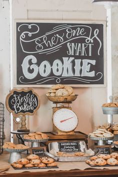 an assortment of cookies and pastries displayed on a table