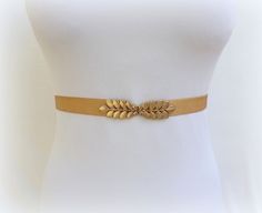 "This classic elastic waist belt with a gold grecian leaf clasp is the perfect finishing touch to upgrade every outfit. You can wear it on a dress, skirt, jumpsuit, pants or tunic. Comfortable and flattering to a woman's waistline. ❤ Sizes: XS Fits waists 25\"- 27\" (63- 68cm) Length end to end 24\" (60cm) S Fits waists 27\"- 29\" (68- 73cm) Length end to end 26\" (65cm) M Fits waists 29\"- 31\" (73- 78cm) Length end to end 28\" (70cm) L Fits waists 31\"- 33\" (78- 83cm) Length end to end 30\" ( Gold Fitted Belt For Formal Occasions, Formal Fitted Gold Belt, Gold Fitted Belt, Chic Gold Belt For Summer, Elegant Rope Belt For Spring, Gold Adjustable Belt For Spring, Adjustable Gold Belt For Summer, Gold Adjustable Belt For Summer, Gold Belt For Party Occasions In Spring