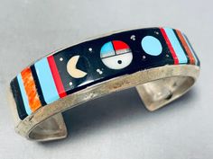 "MAKE US AN OFFER BY CLICKING THE \"MESSAGE SELLER\" Button- We are proud to offer this tremendous Navajo silver bracelet having inlay turquoise, jet, coral and mother of pearl sunface and cosmic designs with handcarved silver borders on the handcarved solid silver cuff! Truly Magnificent Masterpiece! The width of the bracelet measures around 3/4\". Signed by Navajo artist, W.S. Sterling silver, marked. The inside end to end measures around 5-1/4\" with an additional 1-3/8\" gap. Sturdy 35 grams Navajo Bracelet, Native Jewelry, Sterling Silver Cuff, Silver Cuff, Bracelet Making, Beautiful Rings, Mother Of Pearl, Native American, Cuff Bracelets