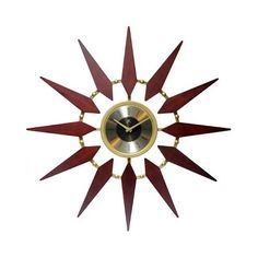 a clock that is made out of wood and has gold trimmings on the face