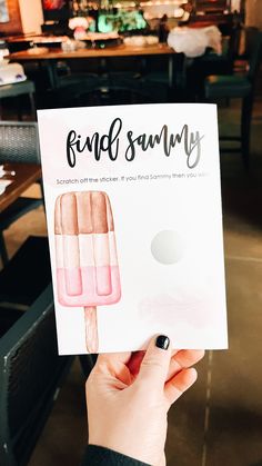 a person holding up a card with an ice cream on it that says friend sunnyy