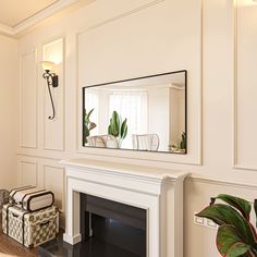 a living room with a fireplace and mirror on the wall