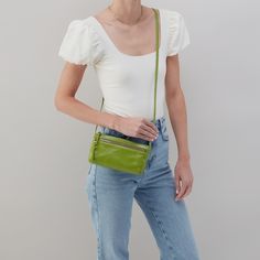 This mini crossbody is perfect in its simplicity, with a zip pocket and room for your keys, wallet and phone. Everyday Green Phone Bag With Zipper Closure, Green Crossbody Phone Bag With Zipper, Green Crossbody Phone Bag With Zipper Closure, Hands Free Bag, Antique Brass Hardware, Mini Crossbody, Leather Dress, Leather Crossbody, Suede Leather