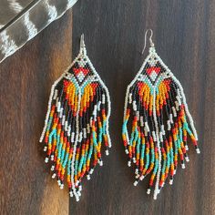 Gorgeous Quality Beaded Earrings. For Pierced Ears Only. Orange, Turquoise, Black, Red, And White Beads. Never Worn, Clean With No Damage. Same On Both Sides. These Are Attention Grabbers And You Are Sure To Get Lots Of Compliments! They Are About 5” Long And About 2” At The Widest Point. Not Super Heavy. Multicolor Southwestern Style Dangling Beads, Southwestern Multicolor Dangling Beads, Southwestern Style Multicolor Dangling Beads, Southwestern Multicolor Earrings With Colorful Beads, Multicolor Southwestern Beaded Earrings, Multicolor Beaded Southwestern Earrings, Festival Multicolor Beaded Fringe Chandelier Earrings, Southwestern Style Multicolor Jewelry With Black Beads, Adjustable Multicolor Beaded Fringe Earrings