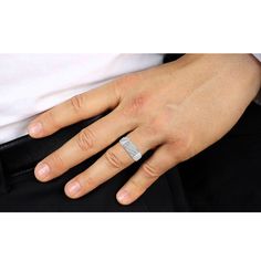 a person wearing a wedding ring on their left hand