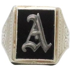 "Stunning vintage white gold ring with the initial \"A\" design on black onyx. The initial \"A\" has an Old English style of writing. The black onyx stone is secured with a fine bezel set. This ring is a size 9 1/2 and weighs a total of 7.8 g. This ring is hallmarked 14K and was inspected by a professional for authenticity." Personalized Black Engraved Ring For Anniversary, Classic Black Initial Ring For Formal Occasions, Black Engraved Ring With Polished Finish For Formal Occasions, Black Elegant Initial Ring For Anniversary, Formal Black Engraved Ring With Polished Finish, Elegant Black Initial Ring For Anniversary, Black Initial Ring With Polished Finish As Gift, Black Round Jewelry With Initials, Gift Black Initial Ring With Polished Finish