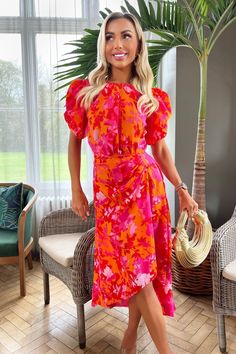 Stay on trend with this pink and orange floral printed midi dress from AX Paris. Featuring short puff sleeves, a round neckline, a zip-up back, and a high-low style skirt with a gathered side detail. Style with flats or heels and add some sophisticated jewellery for a chic evening look. Short Puff Sleeve, Black Dress Prom, Playsuit Dress, Paris Print, 21st Dresses, Uk Clothing, Maxi Dress Cocktail, Midi Dress Party, Orange And Pink