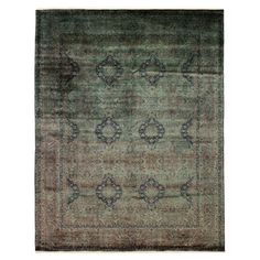 an antique rug with blue and green colors